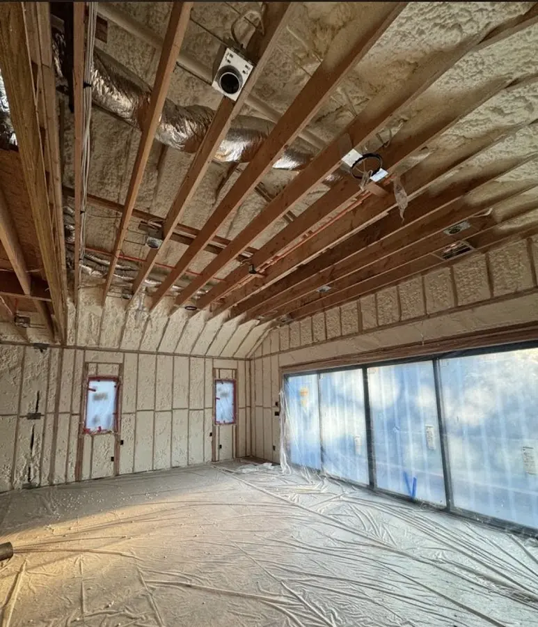 Interior walls and ceiling insulated with spray foam during new construction in Bar Harbor